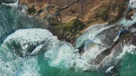 Waves-breaking-over-rocks-at-low-tide-Sydney-Australia