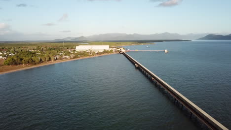Aerial-footage-high-up-looking-towards-Lucinda-panning-along-Lucinda-sugarcane-jetty-in-Tropical-North-Queensland-Australia