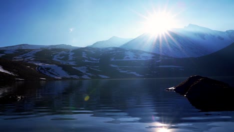 Sunset-and-sun-star-and-reflection-in-the-lagoon-of-the-moon-and-a-nice-view-of-the-nevado-de-toluca-volcano-also-called-xinantecatl-which-is-rarely-this-snowy