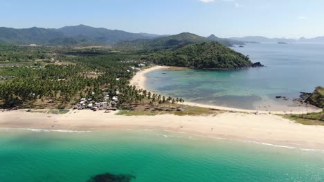 Aerial-footage-of-coastline-with-beach-and-jungle
