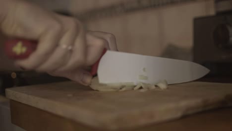 Second-cut,-cutting-onions-with-ceramic-knife