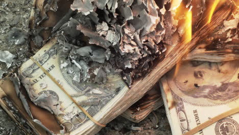 Close-up-of-prop-money-on-fire