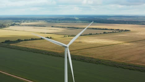 Beautiful-aerial-top-down,-downward-view-of-a-rotating-wind-turbine