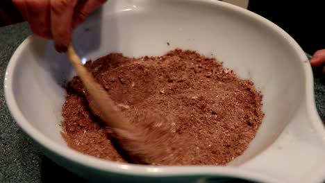 A-person-mixes-ingredients-to-make-a-cake