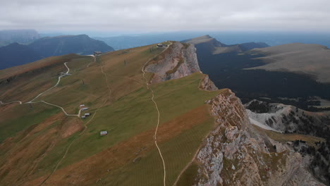 Aerial-shot-from-drone-of-Seceda-mountain-peaks-in-Dolomites,-Italy
