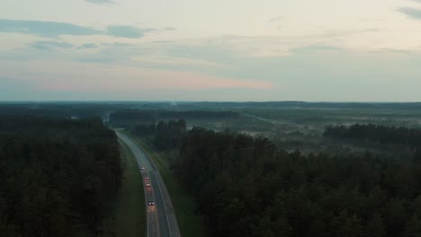Aerial-view-of-a-rural-landscape-with-a-highway-passing-through