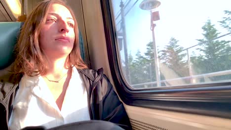 Girl-sitting-on-train-pondering-about-her-commute-to-work