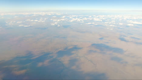 Many-rivers-from-mid-screen-to-bottom-of-screen-in-outback-Australia-on-flight-Darwin-to-Sydney-Northern-Territory-Australia