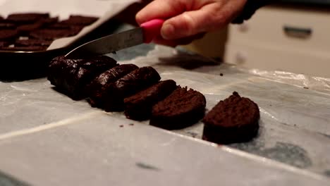 A-person-cuts-some-chocolate-cookies