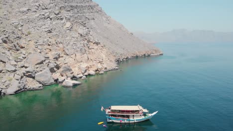 Aerial-shot-from-drone-of-a-dhow-cruise-in-Gulf-of-Oman,-Khasab