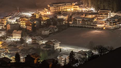 A-full-night-timelapse-view-of-the-Excelsior-hotel-and-the-skiing-slope-Cianros-in-San-Vigilio-di-Maredde,-Italy