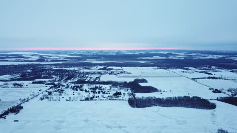 Beautiful-Snow-covered-fields-at-Sunrise,-in-Northern-Canadian-Winter-Weather