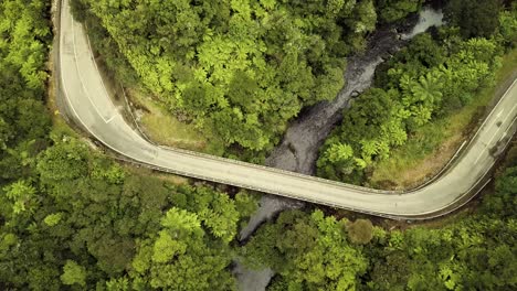 Aerial-view-of-the-Forgotten-World-Highway-in-the-jungle-in-New-Zealand