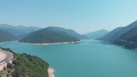 Aerial-view-from-drone-of-a-river-amongst-mountains-and-the-beautiful-nature-in-Georgia