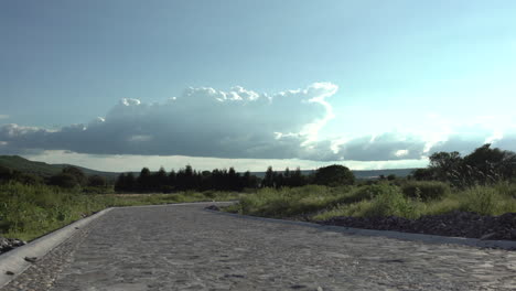 Time-lapse-with-a-path---road-and-beautiful-clouds-background-in-Mexico