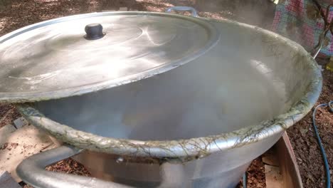 Raw-corn-boiling-in-a-big-pan-outdoors