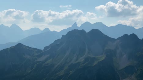 Panoramic-View-Of-Mountains-Alps-With-White-Clouds-Above-From-The-Via-Ferrata-In-Kanzelwand,-Austria