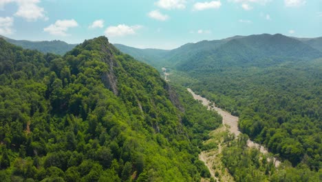 Aerial-view-of-wild-green-forested-mountains-and-cliffs-in-Kakheti-region-in-Georgia