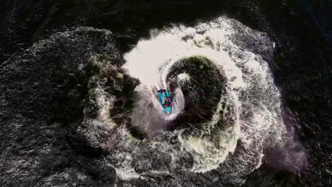 Overhead-view-of-a-man-having-fun-carving-it-up-on-a-jetski-at-spring-break