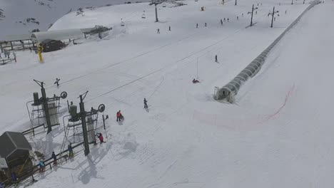 draglift-and-people-skiing-in-Alto-Campoo-ski-resort-aerial-shot