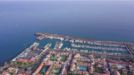 Marina-drone-flyover-top-down-view-sunny-day-on-tropical-island