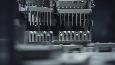 Close-up-of-an-automatic-assembly-line-machine