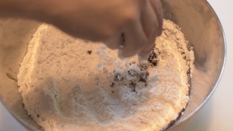 Mixing-flour-caramel-and-cane-sugar-for-caramel-dough-to-make-Christmas-and-Halloween-cookies