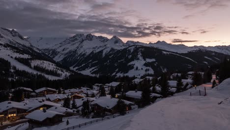 Sunset-over-the-beautiful-white-quiet-village-of-Koenigsleiten-in-Austria--time-lapse