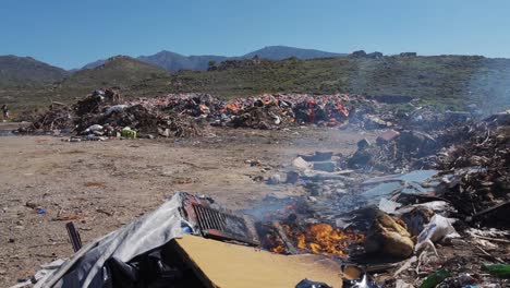 Fire-burning-in-slow-motion-at-a-landfill