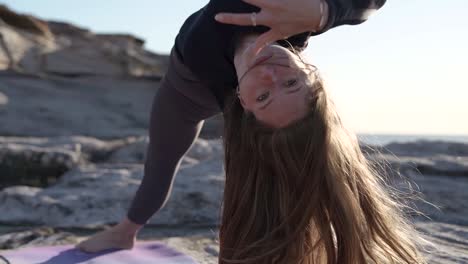 Female-doing-Yoga-on-an-Ocean-Cliff-at-Sunrise