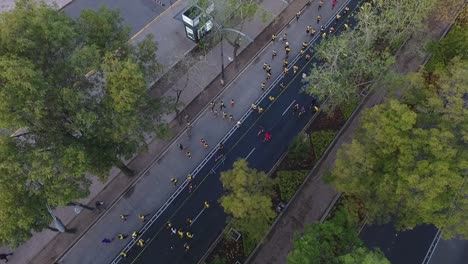 Aerial-shot-of-marathon-runners-on-city-avenue