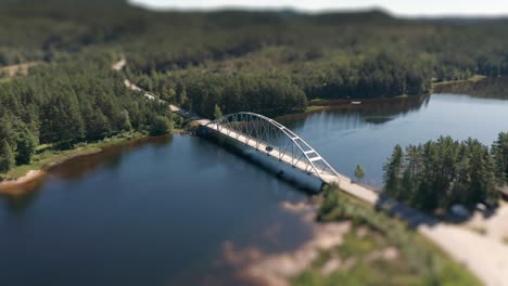 Aerial-view-of-the-bridge-spanning-above-the-Otra-river-near-Killefjorden-camping-in-Southern-Norway