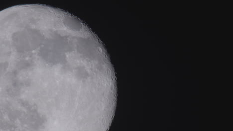 Close-up-view-of-the-full-moon-against-pitch-black-space