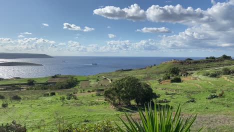 Panning-view-over-green-traditional-terraced-farmland,-near-Mgarr,-Gozo-Malta