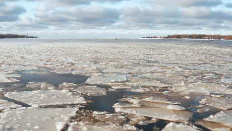 Beautiful-panoramic-fly-over-view-of-large-cracked-ice-floes-floating-in-the-sea
