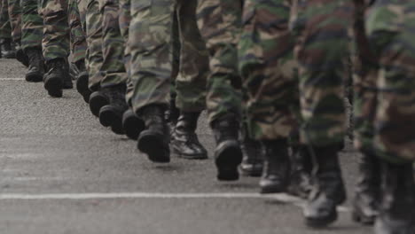 Many-men-marching-in-boots-and-army-clothing
