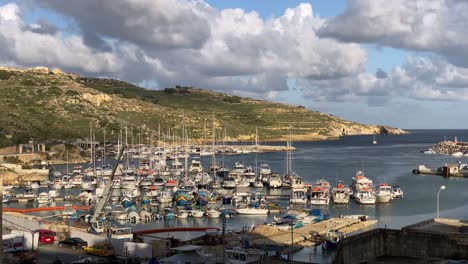 Docked-boats,-Historic-Mgarr-Harbour,-Gozo-Island-Malta,-warm-afternoon-light