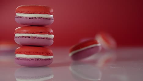 A-macaroon-is-spinning-on-a-surface-near-a-stack-of-macaroons