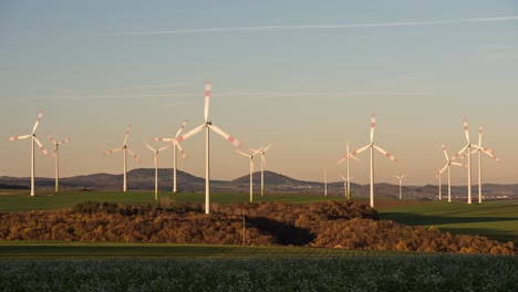 Wind-Farm---Wind-Turbines-Spinning-And-Generating-Electricity-At-Golden-Hour-In-Dungenheim,-Eifel,-Germany