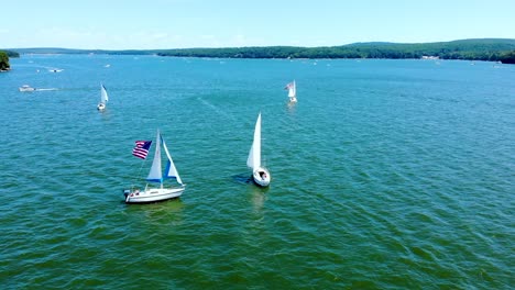 Birds-eye-view-of-sailboats-and-motorboats-at-Wallenpaupack-lake,-Pennsylvania,-USA