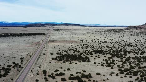 High-angle-aerial-view-of-empty-desert-highway