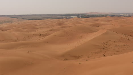 Desert-dunes-seen-from-the-sky-with-fast-motion-and-tilt-down