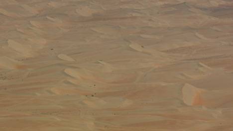 Desert-dunes-flyover-high-altitude-no-horizon