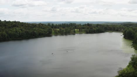 High-angle-aerial-view-of-paddlers-in-small-lake-in-New-Jersey