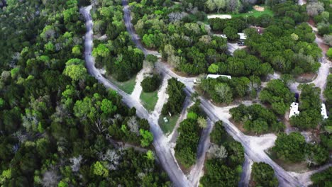 Top-down-aerial-view-of-camping-established-in-forestry-area
