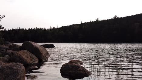Wind-rippled-water-of-Jordan-Pond,-Acadia-National-Park,-Maine,-USA,-meditative-low-angle-shot