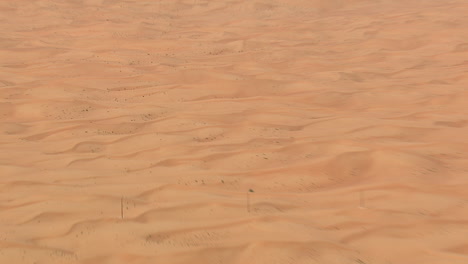 Desert-dunes-seen-from-the-sky-in-sideway-flight