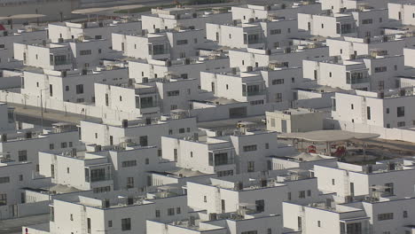 similar-white-houses-constructed-near-the-sea-wide-shot
