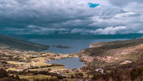 Thick-heavy-clouds-are-moving-over-a-peaceful-haven-on-Hardangerfjord