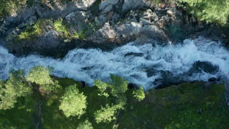A-glimpse-over-the-Stikkelvikelva-stream-made-from-the-air:-furious-waters-are-overcoming-the-resistant-rocks,-making-lots-of-white-foam-and-splashes